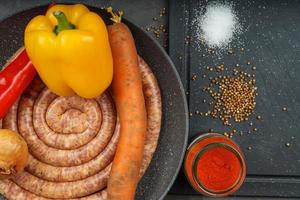 Raw pork saussage with ingredients photo