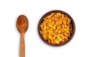 Healthy lifestyle breakfast bowl with granola and spoon on white background photo