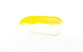 Paint brush stroke of yellow texture on white background photo