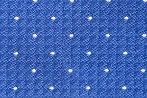 Solid background of blue fabric with a texture pattern photo