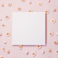 Pink floral background with paper card note photo