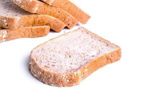 Slice whole wheat bread isolated on white background photo