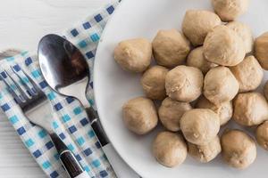 Meatballs on a plate on the table photo