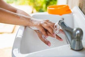 Wash your hands with soap to prevent viruses like Covid photo
