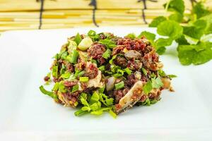 Spicy minced beef salad, larb is traditional Thai food photo