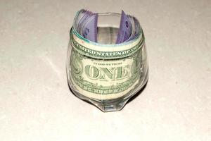One dollar in a glass photo