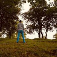 man trekking on the mountain photo