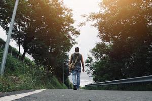 man trekking on the mountain photo