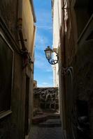 Narrow street of Cefalu Sicily Italy photo