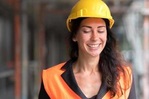 Cheerful woman engineer close up photo