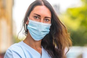 Female doctor with mask close up photo