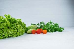 Healthy foodVegetables  On a white  wooden background photo