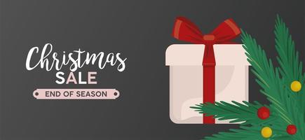 merry christmas sale lettering with gift and leafs vector