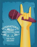 cartel del festival internacional de música con micrófono de levantamiento de mano y letras vector