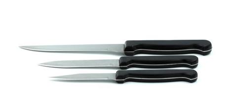 Kitchen knives on white background photo