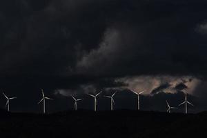 Eight white wind turbines photo