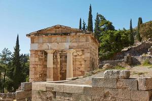 The Athenian treasury in Delphi Greece in a summer day photo