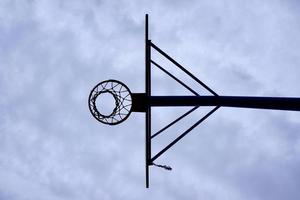 street basketball hoop and blue sky photo