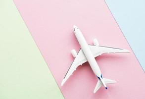 Airplane on pastel background photo
