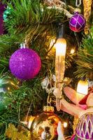 Christmas Tree decorated in a purple theme closeup photo