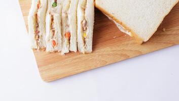 Delicious homemade sandwich tuna on wooden place photo