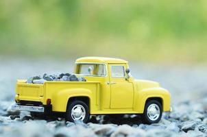 Yellow truck toys with green bokeh light backgrounds