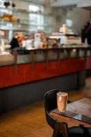 Iced coffee on a table inside a cafe photo