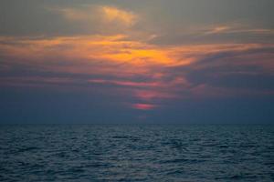 seascape with dramatic sunset over the sea photo