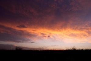 Beautiful sinset in orange and purple colors photo