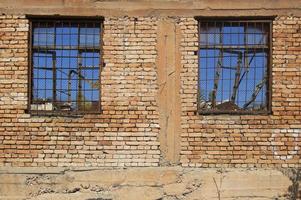 Old ruined house with two windows photo