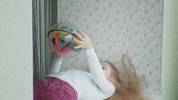 Little girl play with three dimensional toy puzzle