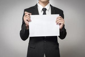 businessman holding paper photo