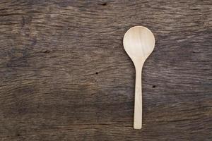 Wooden spoon on wood table photo