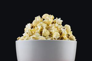 close up of mushroom Popcorn in a white bowl with black background photo