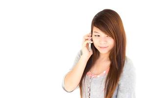 Thai woman is calling tsomeone on white background and blank area at left side