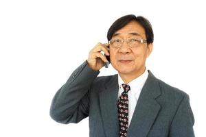 old aged thai businessman is calling and blank area at left side
