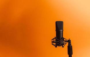 Streaming microphone over an orange background photo