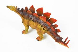 Dinosaur rubber toy isolated on white photo