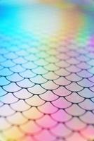 An amazing and vibrant macro of iridescent surface with scale texture as background photo