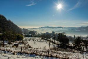 plain and fog in the snow two photo