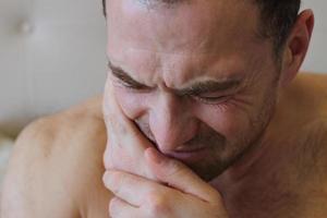 Man staying in bed with toothache photo