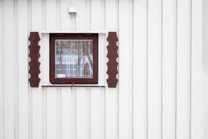 Exterior close wooden window with curtain on timber wall house photo