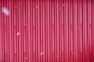 Red surface container warehouse lined with snowing photo