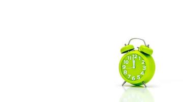 Green alarm clock isolated on a white background photo