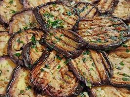 Grilled and seasoned aubergines photo