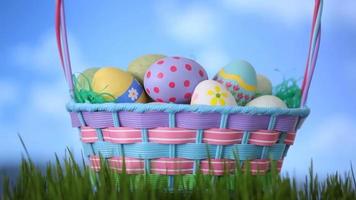 Clouds move by an Easter eggs basket sitting in the grass video