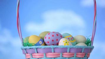 Clouds move by Easter eggs basket video