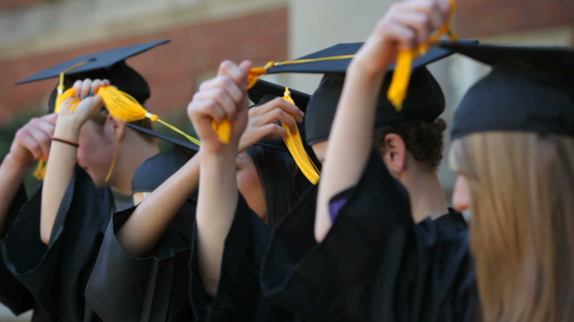 Graduates move tassels and celebrate 2493018 Stock Video at Vecteezy