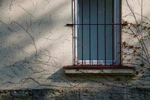 window on the old facade of the house photo