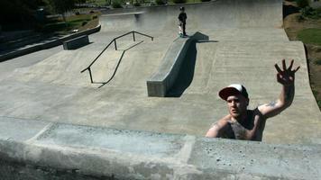 Skateboarder catches air at skate park